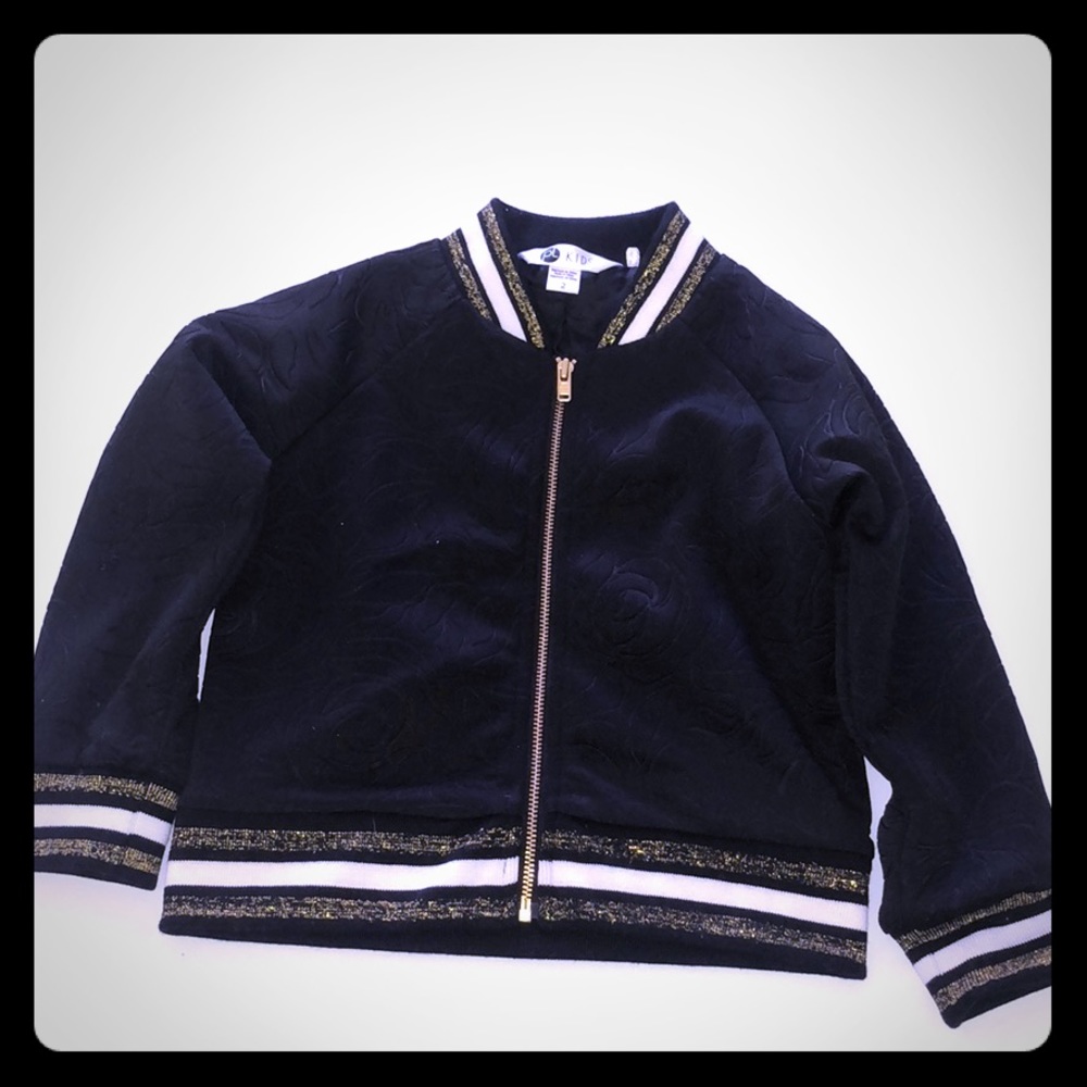 Black , gold with a little white 2 T jacket